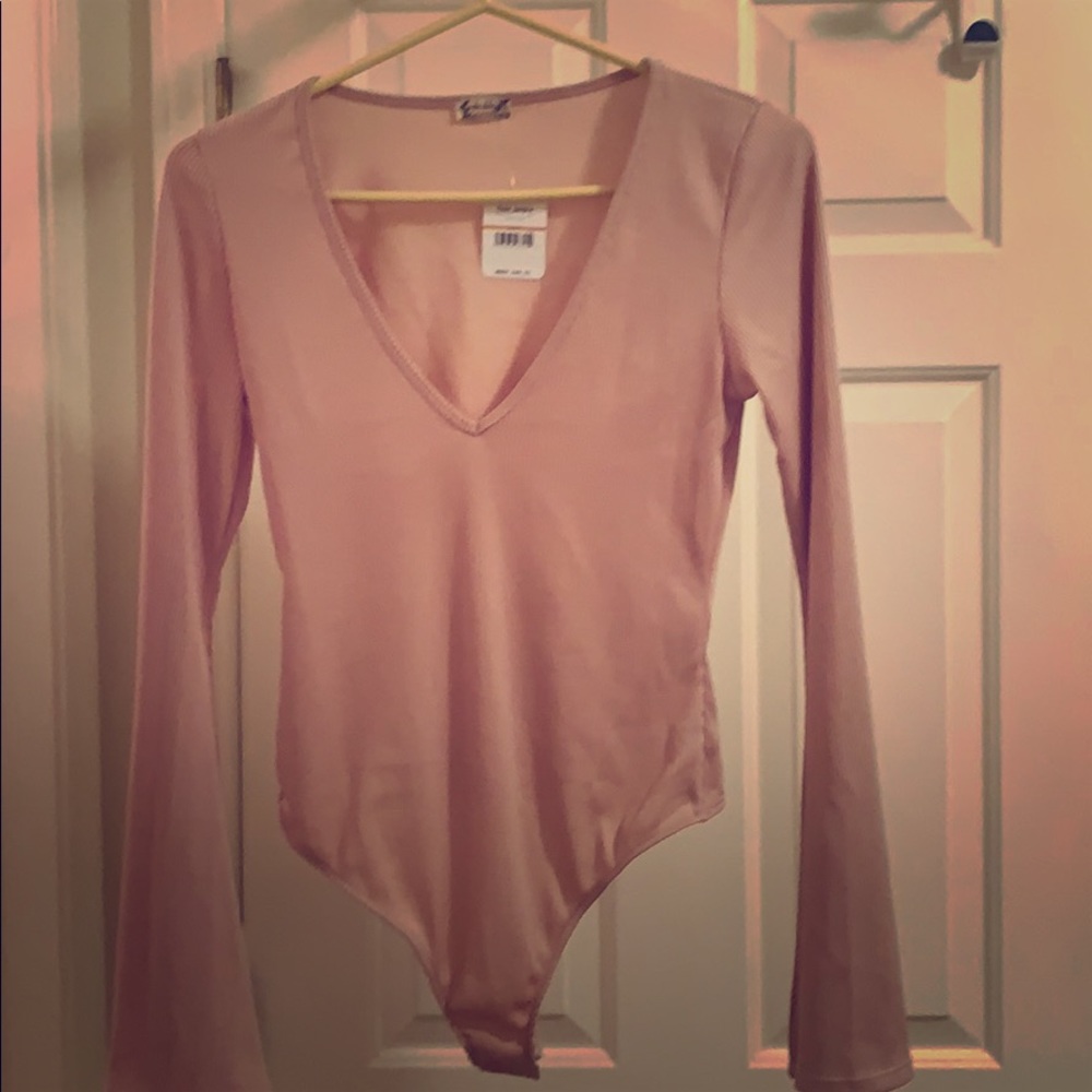 Beautiful dusty rose free people body suit.